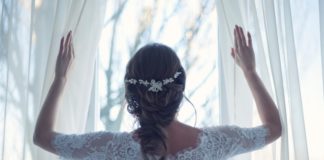 bride-opening-curtains-wedding-morning