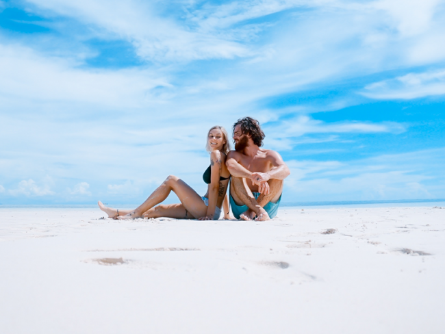 Couple on beach - 6 Money-Saving Tips for Planning Your Honeymoon